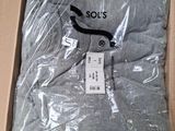 the shirt is in a box on the floor in the room