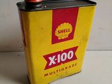 an old shell oil can sitting on top of a table