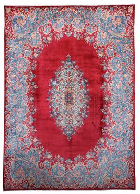 a red and blue rug with a medallion design
