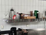 a kitchen counter with a bunch of items on it