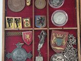 a wooden box with many different items inside of it