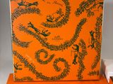 an orange box with a drawing of a dragon on it