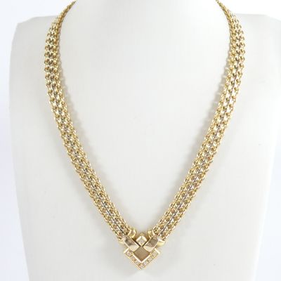 an image of a gold necklace with a cross on it