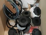 a cardboard box filled with assorted items and a roll of toilet paper