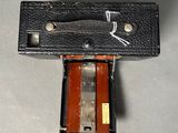 a black case with a knife in it on a table