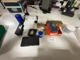 a lot of electronics on a table in a room