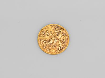 une pièce d'or à l'effigie d'un homme à cheval