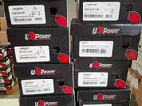 boxes of u - power products stacked on top of each other in a warehouse