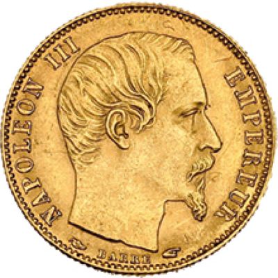 un gros plan d'une pièce d'or représentant le profil d'un homme
