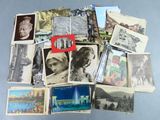 a pile of old postcards with pictures of people on them