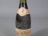 a bottle of wine that is sitting on a table