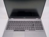 an open laptop computer sitting on top of a white table