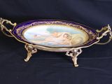 a close up of a plate on a stand on a black background
