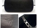 an image of a picture of a black purse with a zipper