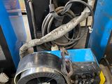 a machine that is sitting on the floor in the garage