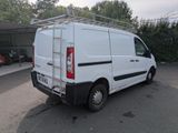 a white van that is parked in a parking lot