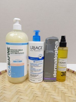 a bottle of lotion and a bottle of lotion sitting on a basket