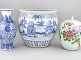 three vases sitting next to each other on a table