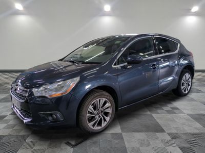 a picture of a blue car parked in a garage