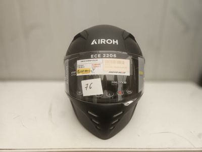 the helmet is black and has a sticker on it