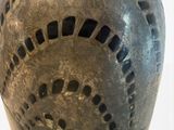 a close up of a helmet with holes in it