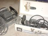 a box with a drill and other tools on the floor