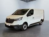 the white van is parked in a large room with a ceiling fan