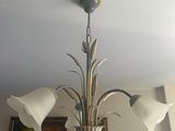 a chandelier hanging from the ceiling in a living room