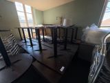 a room that has a bunch of tables and chairs in it