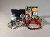 two pieces of jewelry sitting in a box on a table