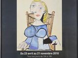 the poster for picassoo collection privee is hanging on the wall