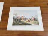 two framed pictures of people riding horses on the beach