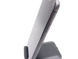 a cell phone on a stand on a white surface
