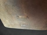 a close up of a piece of metal on a table