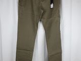 a pair of khaki pants hanging on a white curtain
