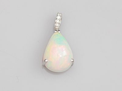 an oplite and diamond pendant