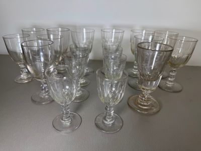 several empty wine glasses are lined up on a table