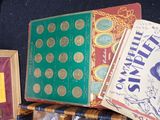 several books sitting on top of each other on top of a table