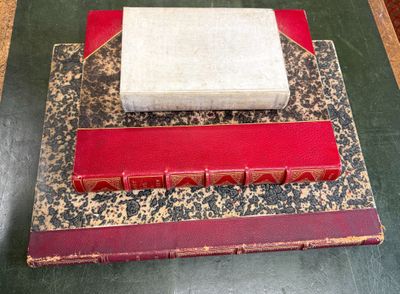 two books stacked on top of each other on a table