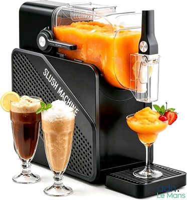 a juicer that has two drinks in front of it