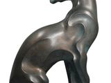 sculpture of a cat sitting on its hind legs on a white background