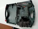 a drill in the case on the table