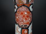 a vase with a design on it on a black background