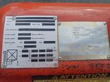 a close up of a sign on the side of an orange machine
