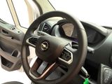a steering wheel and dashboard of a small car