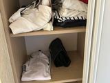 a closet with a lot of clothes on it