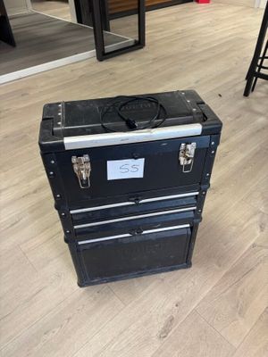 a black suitcase sitting on the floor in a room