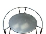 an image of a metal chair with a round seat on a white background