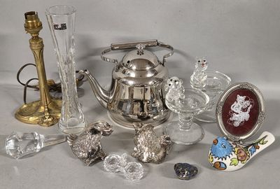 a silver tea pot and a silver tea pot and a gold tea pot and a silver tea pot and a gold tea pot and a glass vase