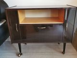 an image of a small cabinet with a drawer on wheels
